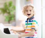 Happy Child Learning Piano
