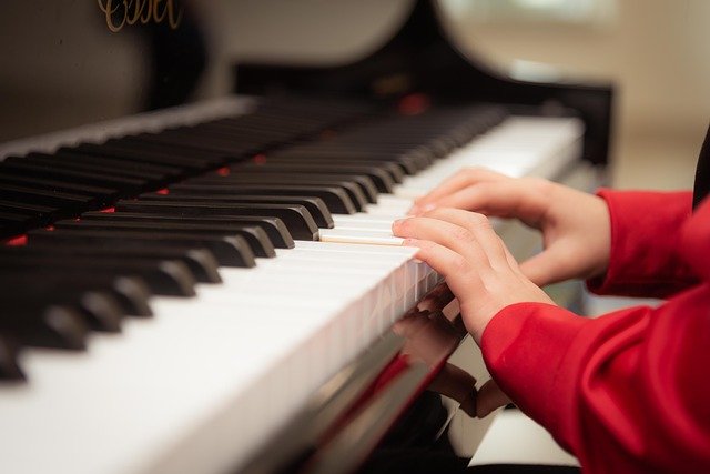 Child's Hands Playing Piano