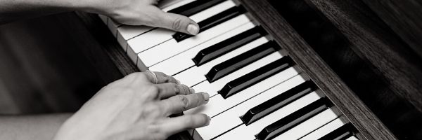 Hands playing piano